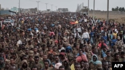 FILE - Captive Ethiopian soldiers walk towards the Mekele Rehabilitation Center in Mekele, the capital of Tigray region, Ethiopia, on July 2, 2021. 