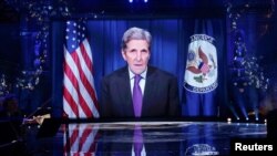 FILE - A pre-recorded message from John Kerry, U.S. Special Presidential Envoy for Climate, is shown on a screen on stage, during the first Earthshot awards ceremony at Alexandra Palace in London, Britain, Oct. 