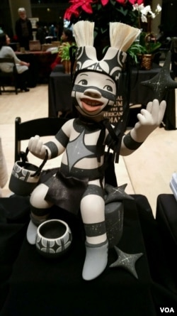 Kathleen Wall's ceramic dolls, crafted from clay collected from villages near her home in New Mexico, look happy and joyful. (D.Aiken/VOA)