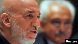 Afghanistan's President Hamid Karzai addresses media representatives during a press interaction in New Delhi, Dec. 14, 2013.