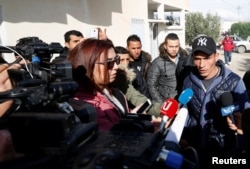 Walid, brother of suspect Anis Amri who was sought in connection with the truck attack on a Christmas market in Berlin, speaks to members of the media near their family home in Oueslatia, Tunisia, Dec. 22, 2016.