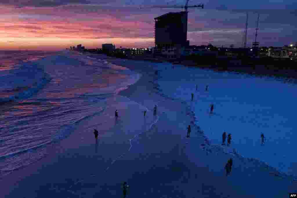 An aerial picture of people visiting the beach while waiting for Hurricane Michael, Oct. 9, 2018, in Panama City Beach, Florida. 