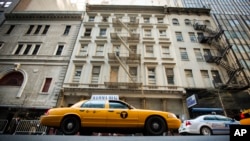 It is not always easy to get a cab in New York City. But once you get one, you may not have to say a word. Pictured here, a taxicab drives past 51 Park Place, NYC. (REUTERS/Lucas Jackson) 