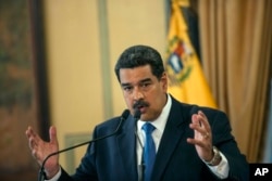 Venezuela's President Nicolas Maduro speaks during a press conference at Miraflore's Presidential Palace in Caracas, Venezuela, Feb. 8, 2019.
