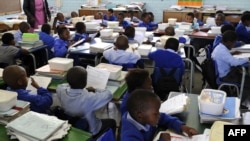 FILE - Pupils study in a classroom in Johannesburg, South Africa, November 2009.