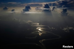 FILE - Aerial view of a river in Peru's Amazon region of Loreto, September 29, 2014.