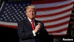 FILE - U.S. President-elect Donald Trump arrives to speak during 'thank you" tour event at Giant Center in Hershey, Pennsylvania, Dec. 15, 2016.
