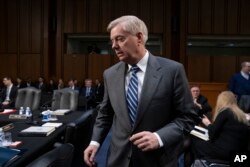 FILE - Sen. Lindsey Graham, R-S.C., is pictured on Capitol Hill in Washington, Feb. 7, 2019. Graham, who had harshly criticized President Donald Trump’s decision to pull U.S. forces out of Syria, is applauding the decision to keep a small contingent of troops there to act as a “stabilizing force.”