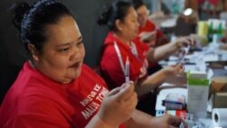 A photo taken and released by Matangi Tonga on Oct. 30, 2021, shows a Tongan nurse preparing to vaccinate people against COVID-19 inside Queen Salote Memorial Hall in Nuku'alofa. (Photo by Eleanor Gee)