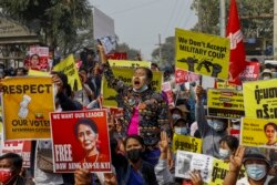 FILE - Demonstrators protest against Myanmar's military junta in Mandalay, Myanmar, Feb. 18, 2021.