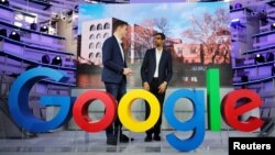 FILE - Google CEO Sundar Pichai, right, and Philipp Justus, Google Vice President for Central Europe and the German-speaking Countries, attend the opening of the new Alphabet's Google Berlin office in Berlin, Jan. 22, 2019.