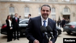 Hariri ispred Jelisejske palate u Parizu 