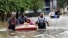 Residents are evacuated from their apartment complex surrounded by floodwaters in Houston, Texas, April 18, 2016.