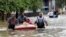 Residents are evacuated from their apartment complex surrounded by floodwaters in Houston, Texas, April 18, 2016.