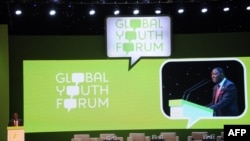 Executive Director of UNFPA Babatunde Osotimehin delivers his speech during the Global Youth Forum in Nusa Dua on Bali island, December 4, 2012.