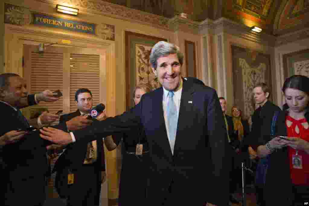 Senator John Kerry emerges after a unanimous vote by the Senate Foreign Relations Committee approving him to become America's next top diplomat, January 29, 2013. 
