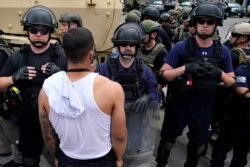Demonstrators gather to protest the death of George Floyd, June 3, 2020, near the White House in Washington. Floyd died after being restrained by Minneapolis police officers.