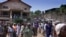 FILE - Several hundred Sierra Leoneans leave a church in Freetown.