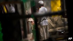 This June 6, 2018 photo, reviewed by US military officials, shows detainees inside the Camp 6 detention facility at Guantanamo Bay U.S. Naval Base, Cuba. 