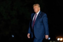 President Donald Trump walks on the South Lawn as he arrives at the White House, Sept. 14, 2020, in Washington from a trip to Phoenix.