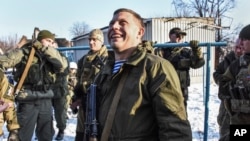 Pro-Russian rebel leader Alexander Zakharchenko, center, surrounded by guards, Jan. 15, 2015.