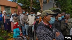 Ethiopians cast their votes in the general election at a polling center in the capital Addis Ababa, Ethiopia, June 21, 2021.