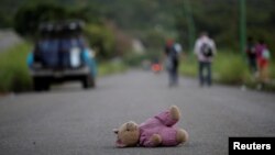 A doll of Central American migrant, part of a caravan trying to reach the U.S., is pictured along the highway to Arriaga from Pijijiapan, Mexico, Oct. 26, 2018.