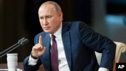 Russia Putin Russian President Vladimir Putin gestures during his annual news conference in Moscow, Russia, Thursday, Dec. 19, 2019