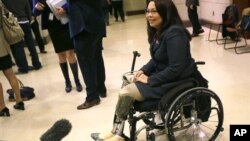 Representative Tammy Duckworth, a veteran of the war in Iraq, speaks with the media on Capitol Hill in Washington, DC, Nov. 14, 2012. (AP Photo/Pablo Martinez Monsivais)