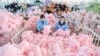Workers work on a production line of stuffed teddy bears for export at a toy factory in Lianyungang, eastern China's Jiangsu province, Nov. 22, 2024. 