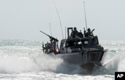 FILE - This Nov. 2, 2015, image provided by the U.S. Navy, shows Riverine Command Boat (RCB) 805 in the Persian Gulf. Iran is holding 10 U.S. Navy sailors and their two boats, similar to the one in this picture.