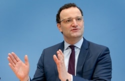 FILE - German Health Minister Jens Spahn addresses the media in Berlin, Germany, Feb. 19, 2021.