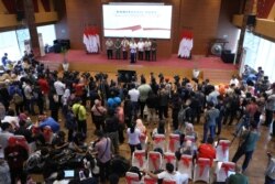 Para jurnalis sedang meliput konferensi pers. (Foto:Badan Nasional Penanggulangan Bencana/BNPB)