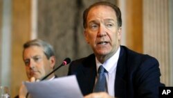 FILE - David Malpass, Undersecretary for International Affairs at the Treasury Dept., right, speaks about Brexit, during a meeting at the Treasury Department, in Washington, Oct. 16, 2018. .