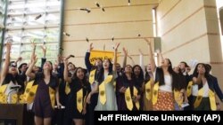 In this March 13, 2020, photo, senior residents of Rice's Wiess College perform a mock commencement ceremony at the school in Houston. (Jeff Fitlow/Rice University via AP)