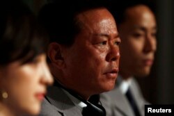 Governor of Tokyo Naoki Inose (C) speaks next to Japanese Olympian Yuki Ota (R) and member of the Tokyo 2020 delegation Christel Takinawa during a news conference in Buenos Aires, Sept. 6, 2013.