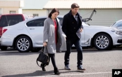 FILE - New Zealand Labour leader Jacinda Ardern and partner, Clarke Gayford, arrive for a funeral at St David's Cooperating Parish in Te Aroha, New Zealand, Sept. 22, 2017.