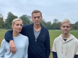 Russian opposition politician Alexei Navalny, his wife, Yulia, and son, Zahar, pose for a picture in Berlin, in this undated image obtained from social media October 6, 2020. (Courtesy of Instagram @NAVALNY/Social Media)