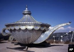 Aladdin's lamp from the defunct casino of the same name is one of many nostalgic signs of bygone Las Vegas saved in the Neon Boneyard.