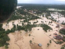 FILE - An aerial view shows the flooded area after a dam collapsed in Attapeu province, Laos, July 25, 2018, in this image from social media.