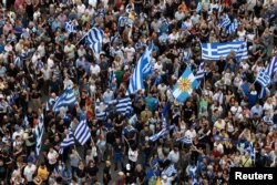 Protesters take part in a demonstration against the agreement reached by Greece and Macedonia to resolve a dispute over the former Yugoslav republic's name, in Thessaloniki, Greece, June 24, 2018.