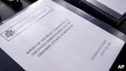 The final report on the 2012 attacks on the U.S. consulate in Benghazi, Libya, where a violent mob killed four Americans, including Ambassador Christopher Stevens, rest on a podium on Capitol Hill in Washington, June 28, 2016. 