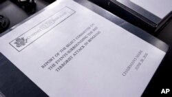 The final report on the 2012 attacks on the U.S. consulate in Benghazi, Libya, where a violent mob killed four Americans, including Ambassador Christopher Stevens, rest on a podium on Capitol Hill in Washington, June 28, 2016. 