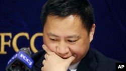 Veteran Chinese dissident Wang Dan pauses during a press conference in Tokyo, Wednesday, May 29, 2019. (AP Photo/Koji Sasahara)