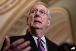 FILE - Senate Majority Leader Mitch McConnell, R-Ky., speaks to reporters on Capitol Hill in Washington, Feb. 26, 2019.