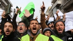 Jordanians chant slogans during a protest against cartoons depicting the Prophet Muhammad in the French magazine Charlie Hebdo, after Friday prayers in Amman, Jan. 16, 2015.