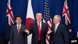 Japan's Prime Minister Shinzo Abe, left, U.S. President Donald Trump and Australia Prime Minister Malcolm Turnbull attend a trilateral meeting during the opening ceremony of the 31st Association of South East Asian Nations (ASEAN) Summit in Manila on Nove