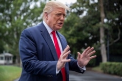 President Donald Trump speaks with reporters on the South Lawn of the White House, July 31, 2020.