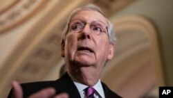 FILE - Senate Majority Leader Mitch McConnell, R-Ky., speaks to reporters on Capitol Hill in Washington, Feb. 26, 2019. 