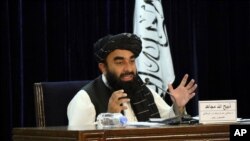FILE - Taliban spokesman Zabihullah Mujahid speaks during a press conference in Kabul, Afghanistan, Sept. 7, 2021.